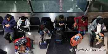 A plane slid off the runway and more than 800 flights were canceled as winter weather hit the Midwest