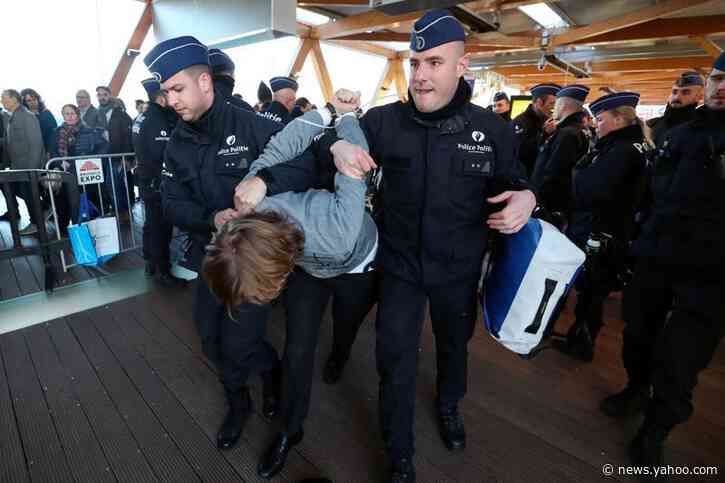 Police detain 185 climate protesters at Brussels car show
