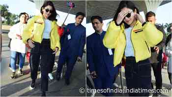 Anushka Sharma shines like a thousand suns in a yellow jacket as she gets papped at the airport