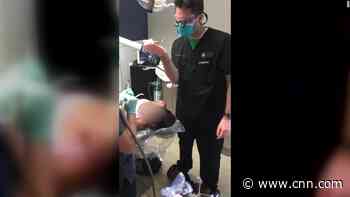 Dentist convcted after being filmed extracting a tooth while on a hoverboard