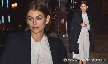 Kaia Gerber displays her sense of style in elegant ivory dress as she attends Prada party in Paris