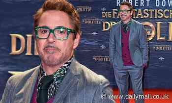 Robert Downey Jr. suits up in stripes as he steps out at the Berlin premiere of Dolittle