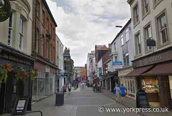 Emergency services 'coax' down man from scaffolding in Scarborough