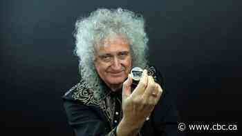 A 'who would've thought it' moment: Brian May unveils Royal Mint's Queen coin