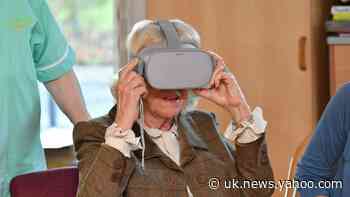 Camilla dons virtual reality headset during visit to hospice