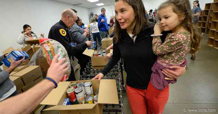 Mayor Mendenhall, volunteers work in service on MLK Day by assembling donations for food bank