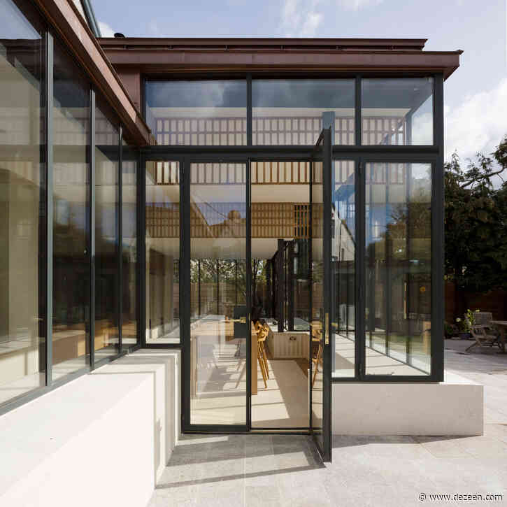 Glazed sun room with copper parapet extends Dublin house