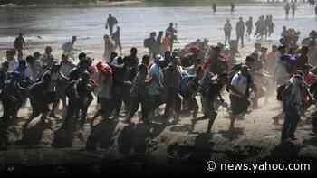 Migrants tear-gassed as they try to storm into Mexico