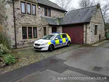 Police crime scene investigators close off Smithills home