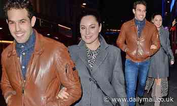 Kelly Brook cosies up to boyfriend Jeremy Parisi on evening stroll in London 