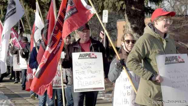Frontline workers, union members and supporters rally in Lethbridge against healthcare cuts