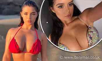 Demi Rose shows off her sensational curves in a tiny red bikini during a wet beach shoot