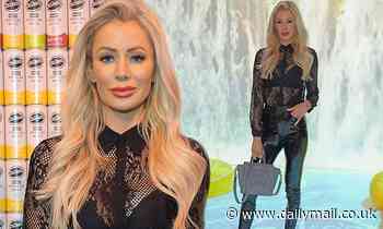 Love Island's Olivia Attwood cuts a sultry figure in black sheer top and leather trousers