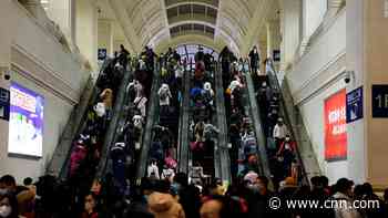 China puts more cities on lockdown and scraps New Year events