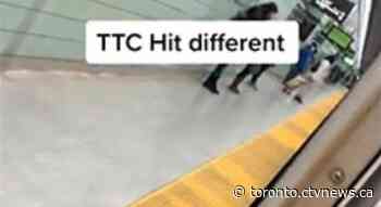 Video appears to show passenger sticking hands out of moving subway train