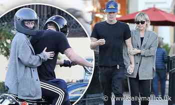 Miley Cyrus wraps her arms around beau Cody Simpson on a romantic dinner date in Calabasas   