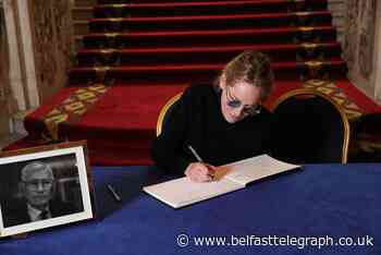Hollywood star Sharon Stone appears at Belfast's City Hall to sign Mallon book of condolence