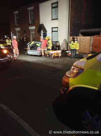 Two people cut free after car collides with house in Lord Street, Westhoughton