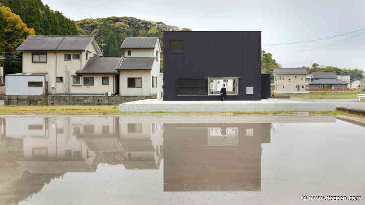 Atelier Kento Eto designs minimal black house hiding lofty interiors