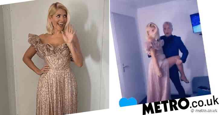 Holly Willoughby dazzles in Dancing On Ice gown as she tangos with John Barrowman backstage