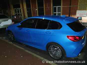 Driver abandons car and hides under vehicle in Bolton