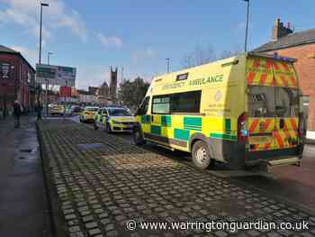 Armed police on Church Street after man injured in flat