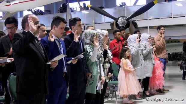 Syrian refugee family of 11 sworn in as Canadian citizens at special ceremony in Calgary