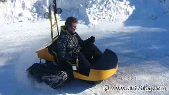 This electric snow sled has a top speed of 28 mph