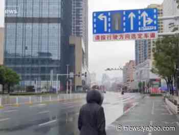 A teacher's videos inside quarantined Wuhan show the streets eerily deserted and lines out the door at the pharmacy
