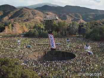 A giant Snickers ‘Fixes the World’ in the candy bar’s latest Super Bowl spot