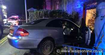 Car dramatically crashes into house in Rhondda