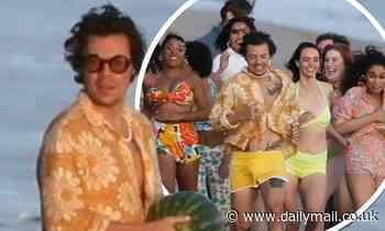 Harry Styles  is CHASED down the beach by dozens of models