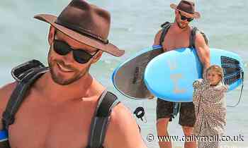 Chris Hemsworth hits the waves on surfing outing with daughter India, 7, in Byron Bay - Daily Mail