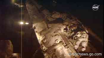 Spacewalking astronauts plug leak, finish fixing detector