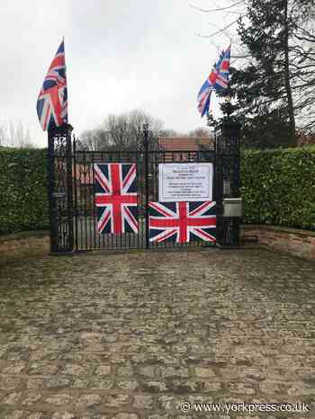 Brexit sign and Union Flags on gates