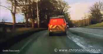 Heart-stopping moment van driver swerves into the wrong lane before narrowly missing traffic island