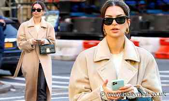 Emily Ratajkowski covers up her coveted figure with a sleek camel coat in New York City
