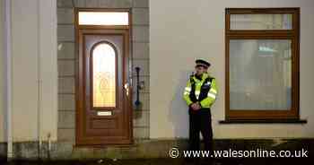 Footage captures smoke, loud bangs and flashes of light as armed police storm residential street
