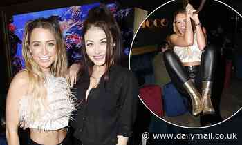 Love Island's Georgia Harrison flashes her abs in a feathered crop top