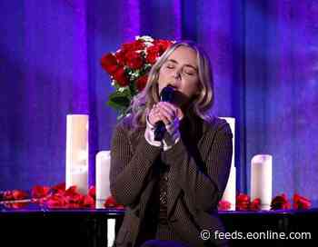 Watch Emily Blunt Beg For Chris Martin's Forgiveness With An Epic Song