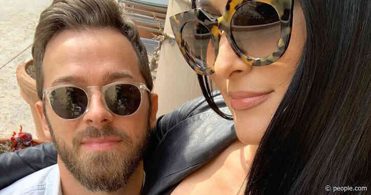 Pregnant Nikki Bella's Fiancé Artem Chigvintsev Cradles Her Bump as She Shows Off Bare Belly