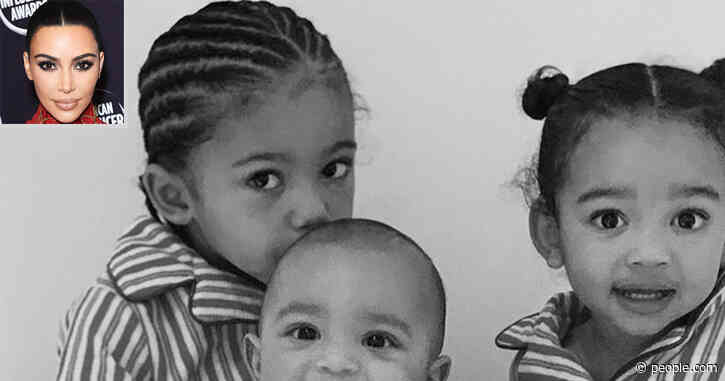 Kim Kardashian's Three Youngest Kids Snuggle Up for Cute Sibling Snap in Matching Pajamas