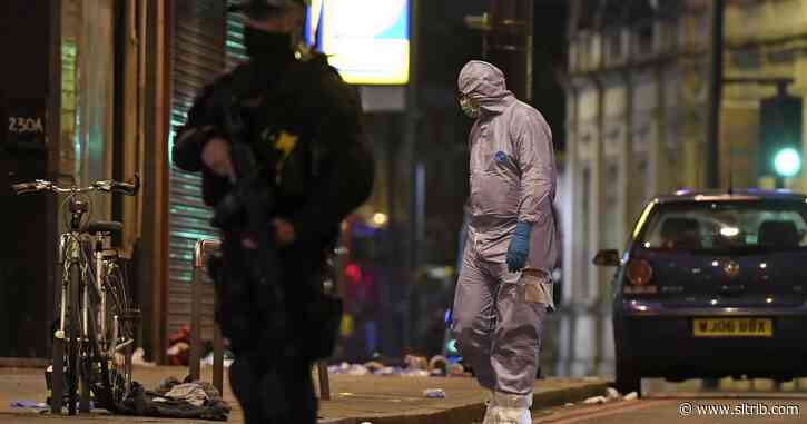Man wearing fake bomb stabs 2 in London and is shot to death