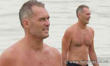 I'm A Celebrity's Tom Williams shows off his post-jungle physique as he goes for a dip at the beach