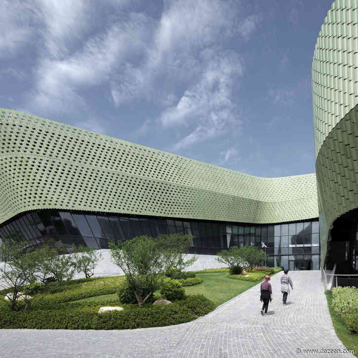 Pale green ceramic tiles cover exhibition centre in China