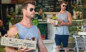 Chris Hemsworth shows off his bulging biceps as he stocks up on some healthy food in Byron Bay - Daily Mail