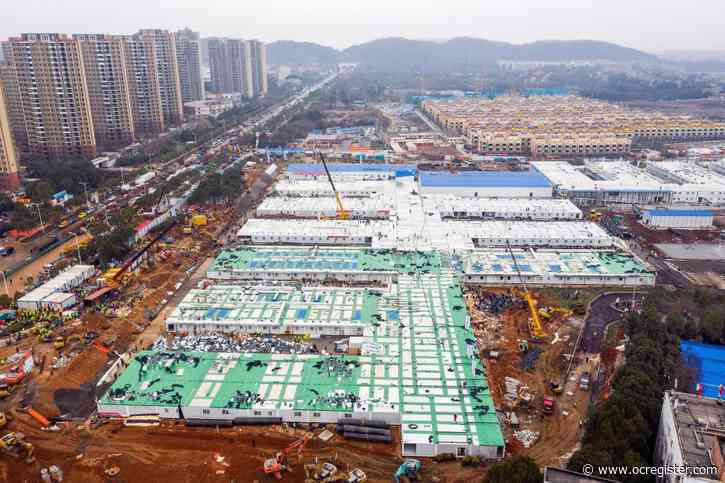 China opens virus hospital, market plunges as toll grows