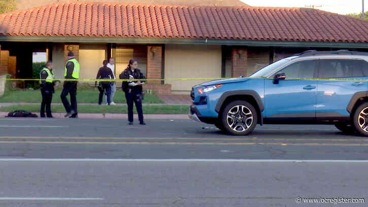 Man dies after struck by car while crossing Tustin street