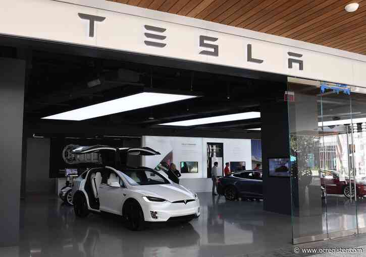 Tesla mania grows as company’s shares top $900