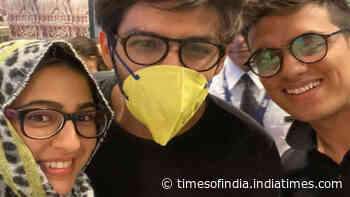 Kartik Aaryan wears mask while Sara Ali Khan covers her head with dupatta as they pose with a fan